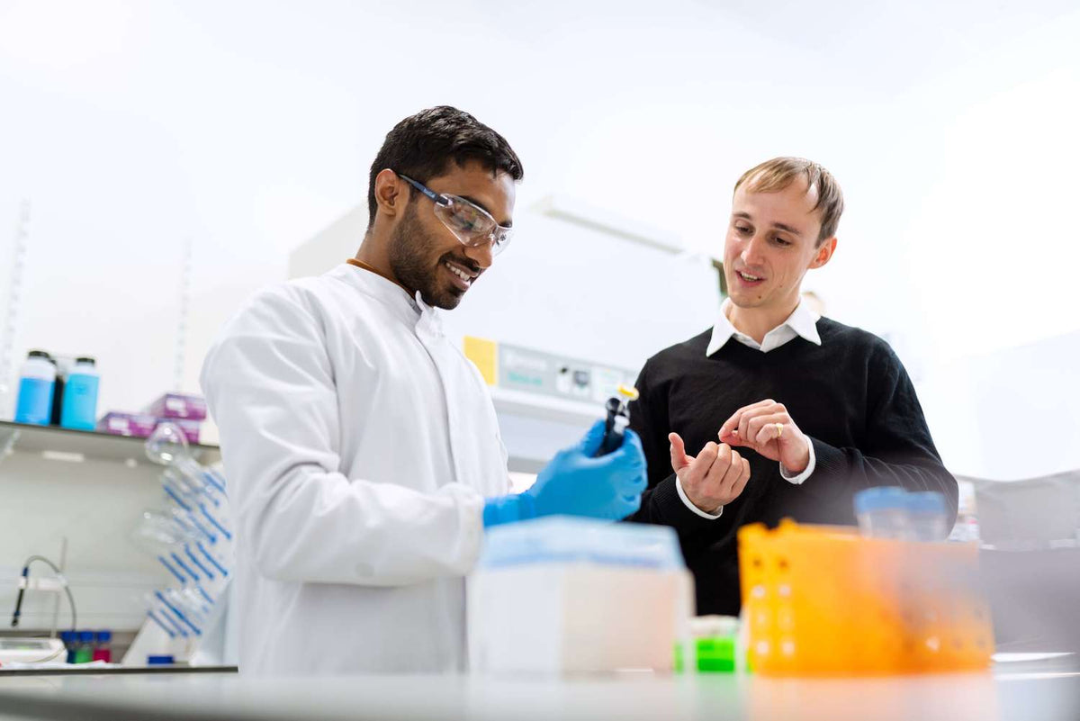 Engineers evaluating medical device models and laboratory prototypes