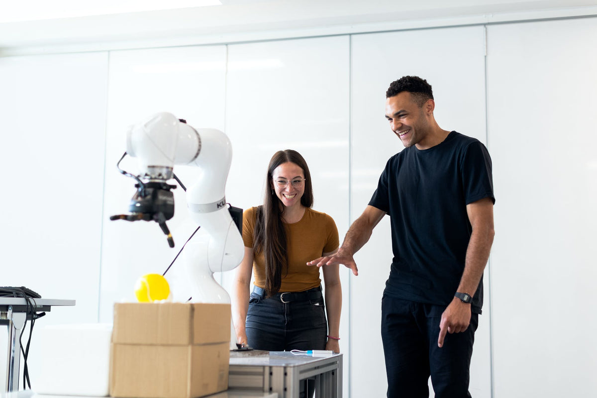 Engineers evaluating a surgical robotics training platform in a laboratory